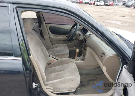 1999 Toyota Corolla Ce z USA, uszkodzony, nr VIN 1NXBR12EXXZ275998